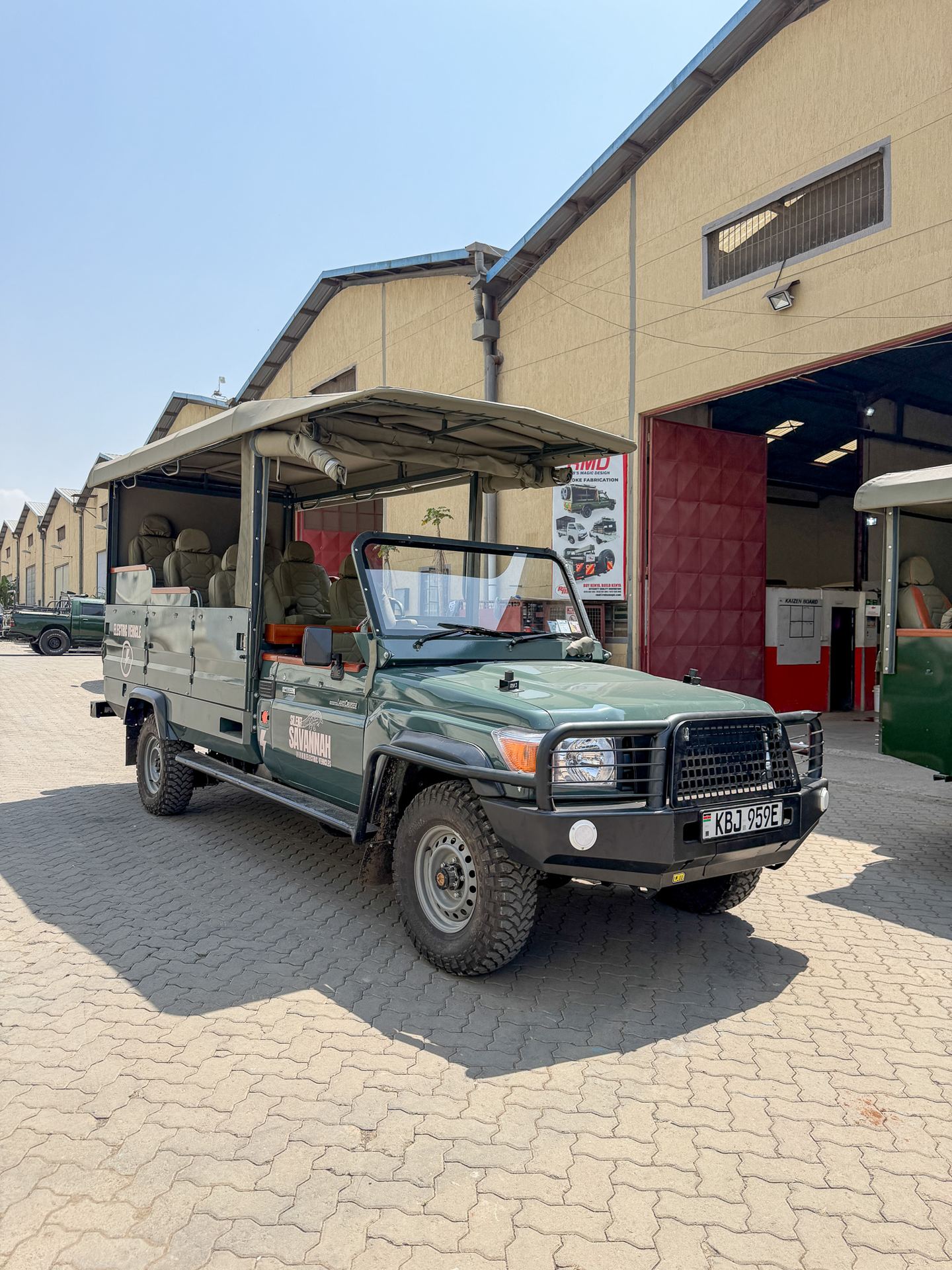 Silent Savannah electric Land Cruiser 79 game viewer outside the Nairobi workshop