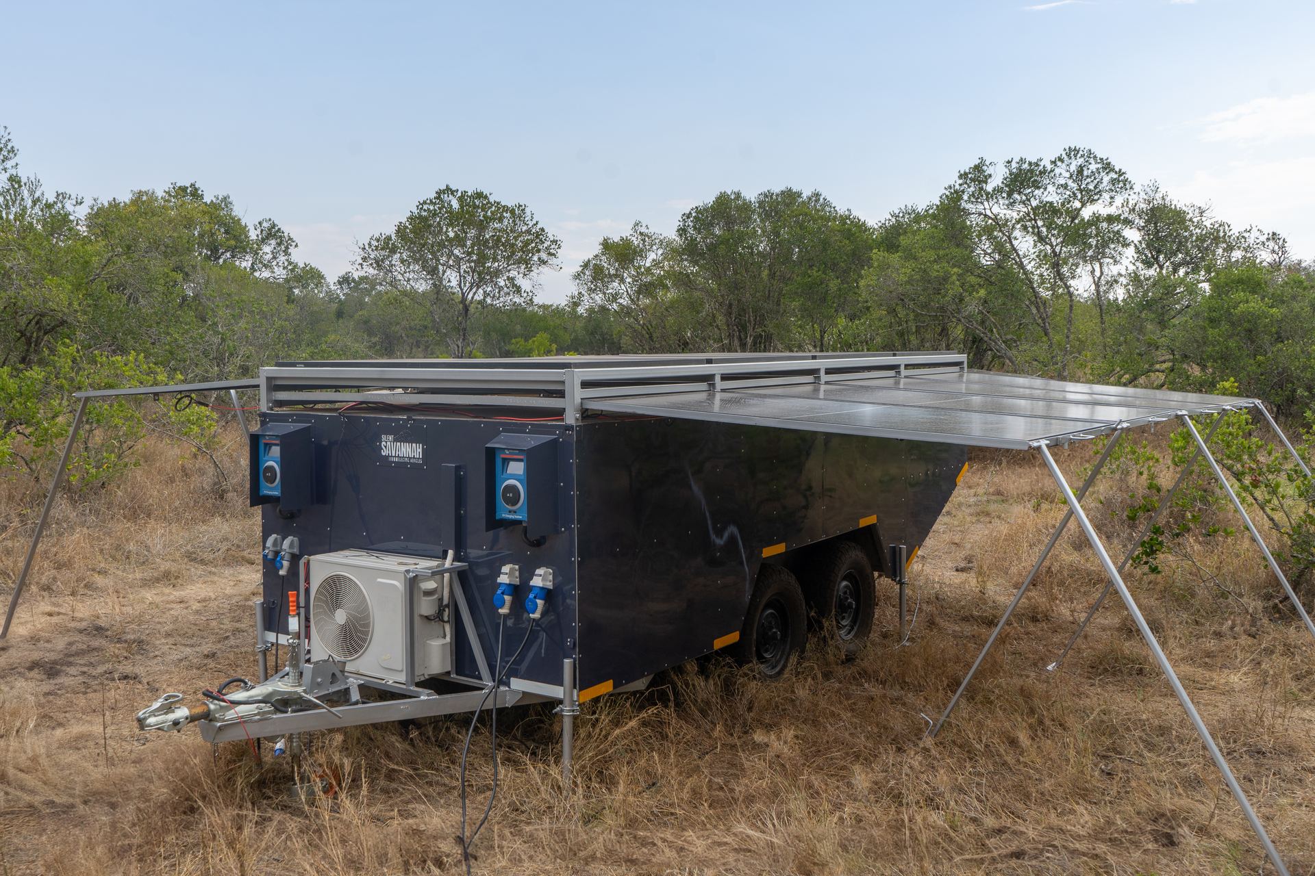 Interior of the Silent Savannah solar trailer showing Victron inverter system