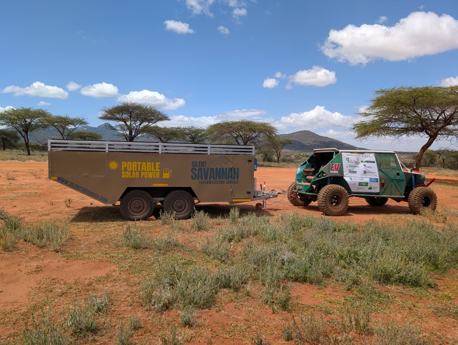 Solar trailer being towed through African bush